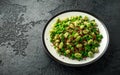 Vegan Green broad beans and quinoa salad with sweet peas and mint. Healthy food. Royalty Free Stock Photo