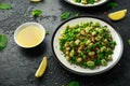 Vegan Green broad beans and quinoa salad with sweet peas and mint. Healthy food. Royalty Free Stock Photo