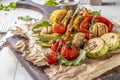 Vegan Grill menu, Grilled vegetables - zucchini, paprika, cherry tomatoes, corn, carrots and champignons served on wooden board at