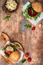 Vegan grilled eggplant, arugula, sprouts and pesto burger. Veggie beet and quinoa burger. Top view, overhead, flat lay. Copy space