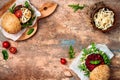 Vegan grilled eggplant, arugula, sprouts and pesto burger. Veggie beet and quinoa burger. Top view, overhead, flat lay. Copy space