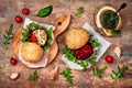 Vegan grilled eggplant, arugula, sprouts and pesto sauce burger. Veggie beet and quinoa burger. Top view, overhead, flat lay.