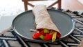 Vegan grilled vegetable wrap on gray plate Royalty Free Stock Photo