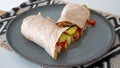 Vegan grilled vegetable wrap on gray plate Royalty Free Stock Photo