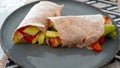 Vegan grilled vegetable wrap on gray plate Royalty Free Stock Photo