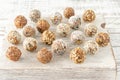 Vegan healthy energy balls with oatmeal, chia seed, coconut flakes, cocoa, dried fruits and almond. No cook energy bites on white Royalty Free Stock Photo