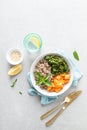 Vegan healthy lunch bowl with quinoa, sauteed kale and baked butternut squash