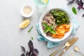 Vegan healthy lunch bowl with quinoa, sauteed kale and baked butternut squash