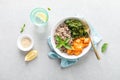 Vegan healthy lunch bowl with quinoa, sauteed kale and baked butternut squash