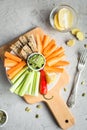 Vegan healthy snacks: guacamole, carrots, celery Royalty Free Stock Photo
