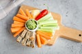 Vegan healthy snacks: guacamole, carrots, celery Royalty Free Stock Photo