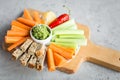 Vegan healthy snacks: guacamole, carrots, celery Royalty Free Stock Photo