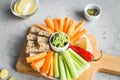 Vegan healthy snacks: guacamole, carrots, celery Royalty Free Stock Photo