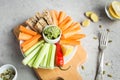 Vegan healthy snacks: guacamole, carrots, celery Royalty Free Stock Photo