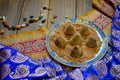 Vegan Homemade Candies in cocoa powder on Ethnic background.