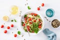 Vegan ketogenic spiralized courgette salad with avocado tomato pumpkin seeds
