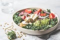 Vegan lentil meatballs salad with kale, avocado, tomato and tahini dressing. Royalty Free Stock Photo