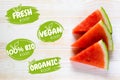 Vegan logos and badges icon set. Watermelon table background