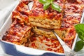 Vegan low-fat tofu lasagna on a white wooden table Royalty Free Stock Photo