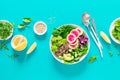 Vegan lunch bowl with quinoa, cucumber, green peas, radish, romanesco and red cabbage, avocado, spinach and arugula salad, healthy Royalty Free Stock Photo