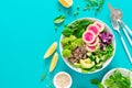 Vegan lunch bowl with quinoa, cucumber, green peas, radish, romanesco and red cabbage, avocado, spinach and arugula salad, healthy Royalty Free Stock Photo