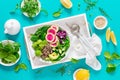 Vegan lunch bowl with quinoa, cucumber, green peas, radish, romanesco and red cabbage, avocado, spinach and arugula salad, healthy Royalty Free Stock Photo