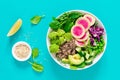 Vegan lunch bowl with quinoa, cucumber, green peas, radish, romanesco and red cabbage, avocado, spinach and arugula salad, healthy Royalty Free Stock Photo