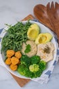 Vegan lunch bowl with quinoa, hummus, chickpeas, avocado, vegetables Royalty Free Stock Photo