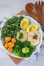 Vegan lunch bowl with quinoa, hummus, chickpeas, avocado, vegetables Royalty Free Stock Photo