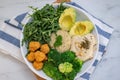 Vegan lunch bowl with quinoa, hummus, chickpeas, avocado, vegetables Royalty Free Stock Photo