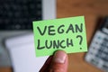 Vegan lunch? written on a memo at the office Royalty Free Stock Photo