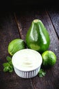 Vegan mayonnaise made from avocado cream with lemon, called green mayonnaise. Vegetarian food