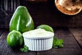 Vegan mayonnaise made from avocado cream with lemon, called green mayonnaise. Vegetarian food