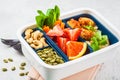 Vegan meal prep containers with beans meatballs, pasta, vegetables, berries, seeds and nuts in a container Royalty Free Stock Photo