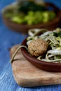 Vegan meatballs, tagliatelle and kale