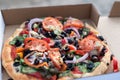 Close-up of vegan Mediterranean style pizza in a pizza box