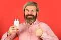 Vegan milk concept. Bearded man hold glass of milk. Pasteurized milk. Vegan milks made from wide variety of beans nut