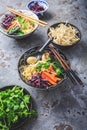 Vegan miso noodle soup with mushrooms, red cabbage, carrots and sprouts Royalty Free Stock Photo