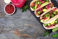 Healthy vegan mushroom tacos. Overhead view on a dark slate background with copy space.