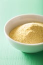 Vegan nutritional yeast flakes in bowl Royalty Free Stock Photo