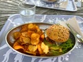 Vegan and organic burger quinoa, cheese and home made chips. Vegan food concept. Royalty Free Stock Photo
