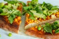 Vegan pizza with chickpeas and broccoli.