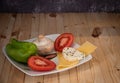 Vegan plate with healthy vegetables and cheese. Nutritious vegetarian lifestyle