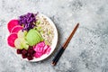 Vegan poke bowl with avocado, beet, pickled cabbage, radishes. Top view, overhead, flat lay.