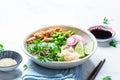 Vegan poke bowl with tofu, brown rice, beans and vegetables. Plant-based diet concept Royalty Free Stock Photo