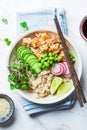 Vegan poke bowl with tofu, brown rice, beans and vegetables. Plant-based diet concept Royalty Free Stock Photo