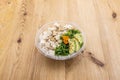 Vegan poke bowl with tofu cubes, wakame seaweed salad, avocado, sesame Royalty Free Stock Photo