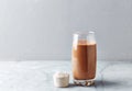 Vegan protein shake made with raw cacao, banana and almond milk. Copy space.