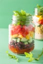 Vegan quinoa bean vegetable salad in mason jars