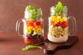 Vegan quinoa bean vegetable salad in mason jars